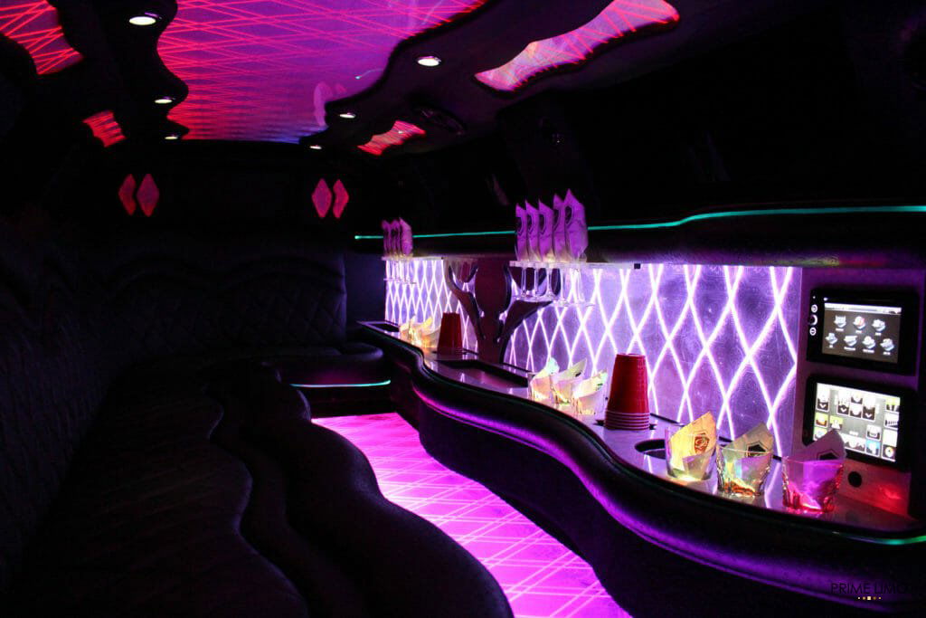 Interior of Chrysler 300 limo with pinkish purple lights